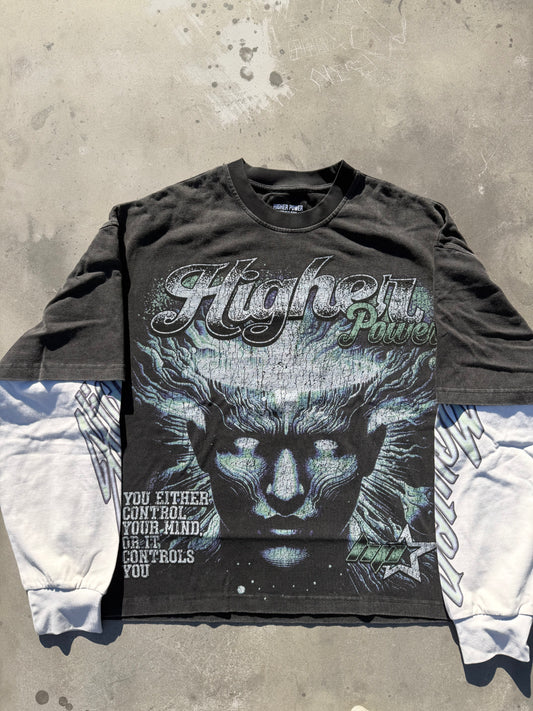 Long-sleeve shirt with graphic design and text on a textured surface